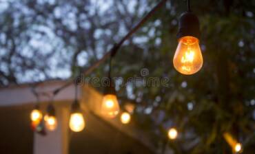 vintage-bulb-string-lights-vintage-bulb-string-lights-hanging-backyard-close-to-night-time-120790145.jpg